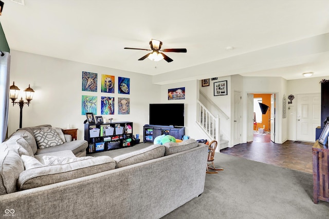 950 Redwood Dr, Franklin, IN 46131 - living room with stairway, ceiling fan, and dark colored carpet