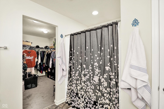 950 Redwood Dr, Franklin, IN 46131 - bathroom with curtained shower and a walk in closet
