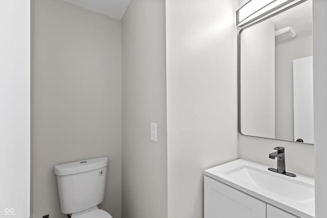 half bath with toilet and vanity