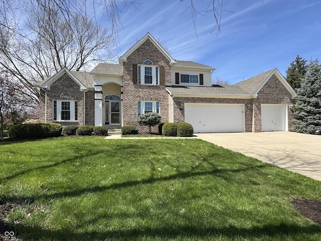 traditional-style home with an attached garage, a front lawn, brick siding, and concrete driveway