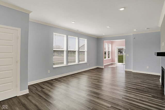unfurnished living room featuring recessed lighting, dark wood-style flooring, baseboards, and ornamental molding