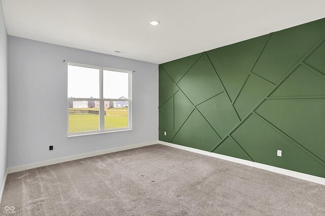 carpeted spare room with baseboards and recessed lighting