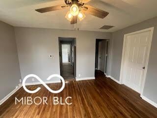 517 Dicks St, Lebanon, IN 46052 - unfurnished bedroom with visible vents, baseboards, a ceiling fan, and wood finished floors
