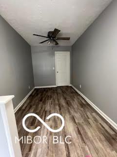 517 Dicks St, Lebanon, IN 46052 - unfurnished room with baseboards, a ceiling fan, and wood finished floors