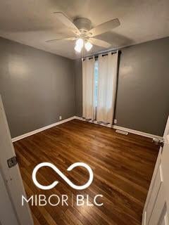 517 Dicks St, Lebanon, IN 46052 - unfurnished bedroom featuring wood finished floors, baseboards, and a ceiling fan