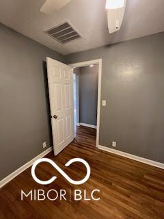 517 Dicks St, Lebanon, IN 46052 - spare room featuring wood finished floors, baseboards, and visible vents
