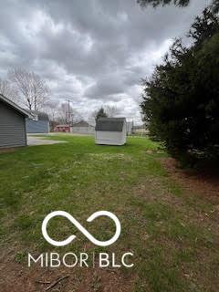 517 Dicks St, Lebanon, IN 46052 - view of yard featuring a shed and an outdoor structure