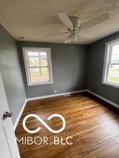 517 Dicks St, Lebanon, IN 46052 - spare room with baseboards, a ceiling fan, and wood finished floors