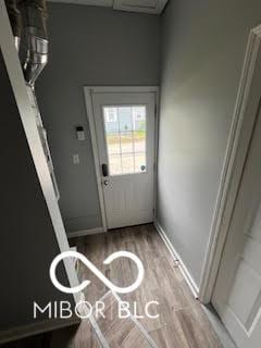 517 Dicks St, Lebanon, IN 46052 - doorway to outside with baseboards and wood finished floors