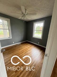 517 Dicks St, Lebanon, IN 46052 - spare room with wood finished floors, ceiling fan, and baseboards