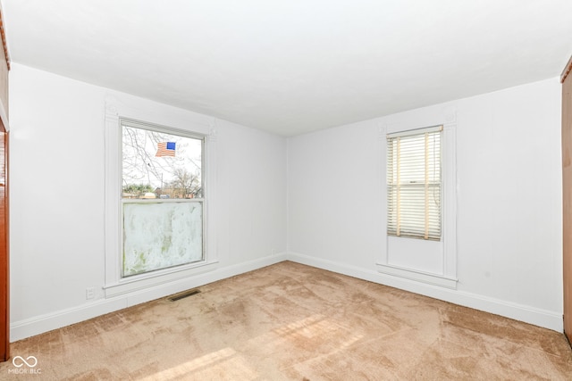 2001 S I St, Elwood, IN 46036 - carpeted empty room featuring plenty of natural light, visible vents, and baseboards