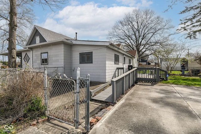 2001 S I St, Elwood, IN 46036 - view of side of property featuring a gate, roof with shingles, and fence private yard