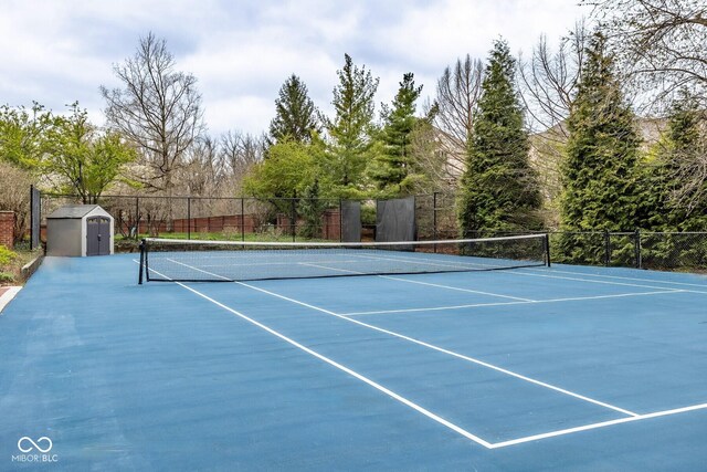 290 Breakwater Dr, Fishers, IN 46037 - view of tennis court with a storage unit, fence, and an outdoor structure