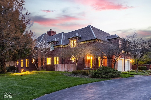 290 Breakwater Dr, Fishers, IN 46037 - french country home featuring a chimney and brick siding