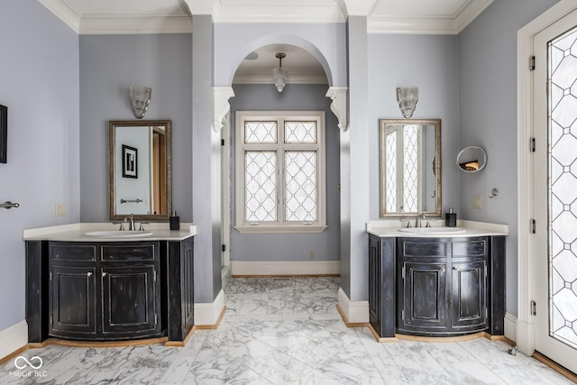 290 Breakwater Dr, Fishers, IN 46037 - full bathroom with marble look tiles, two vanities, ornamental molding, and baseboards