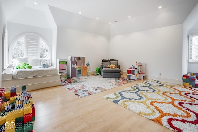 290 Breakwater Dr, Fishers, IN 46037 - recreation room with healthy amount of natural light, wood finished floors, vaulted ceiling, recessed lighting, and baseboards