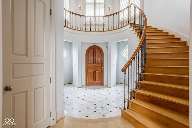 290 Breakwater Dr, Fishers, IN 46037 - entryway featuring healthy amount of natural light, stairway, baseboards, and a high ceiling