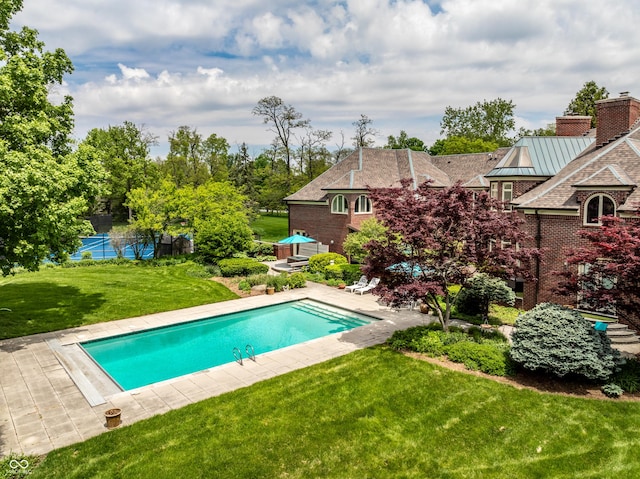 290 Breakwater Dr, Fishers, IN 46037 - outdoor pool featuring a lawn and a patio area