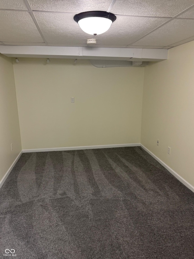 finished below grade area featuring carpet flooring and baseboards