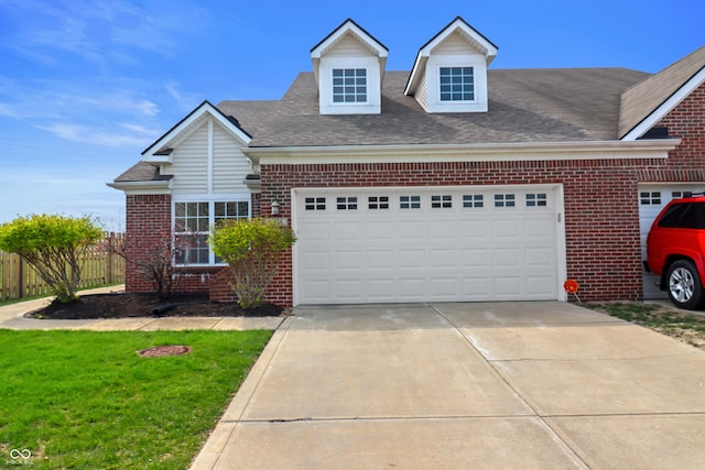 4916 Franklin Villas Dr, Indianapolis, IN 46237 - view of front facade with brick siding, driveway, fence, and an attached garage