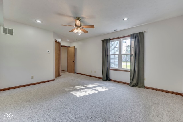 8160 Bold Forbes Ct, Indianapolis, IN 46217 - spare room with light colored carpet, a ceiling fan, and recessed lighting