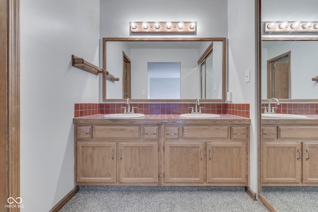 8160 Bold Forbes Ct, Indianapolis, IN 46217 - bathroom with double vanity, backsplash, and carpet