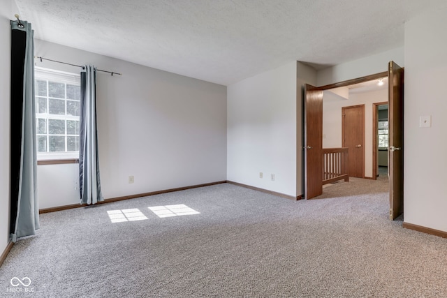 8160 Bold Forbes Ct, Indianapolis, IN 46217 - carpeted spare room with baseboards and a textured ceiling