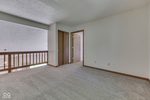 8160 Bold Forbes Ct, Indianapolis, IN 46217 - carpeted empty room featuring baseboards and a textured ceiling