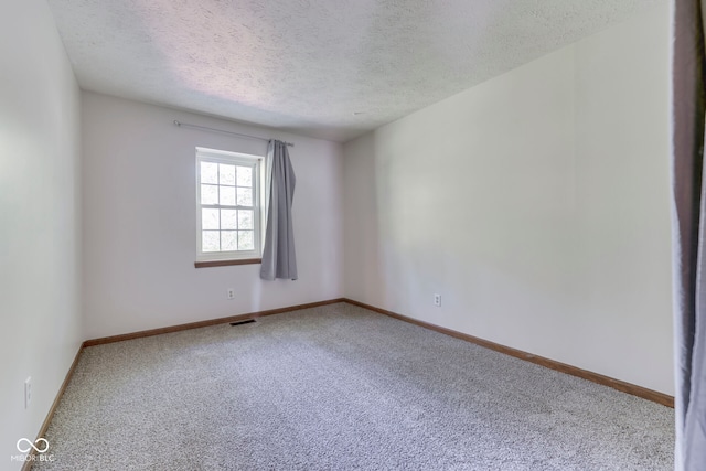 8160 Bold Forbes Ct, Indianapolis, IN 46217 - carpeted empty room featuring a textured ceiling and baseboards