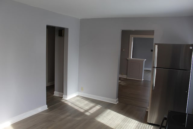 interior space featuring wood finished floors and baseboards