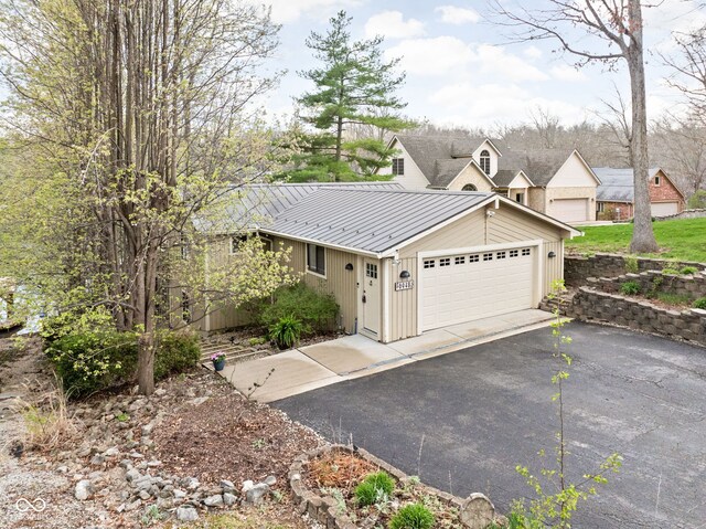 6948 Eagle Dr, Nineveh, IN 46164 - view of side of property featuring metal roof and a garage