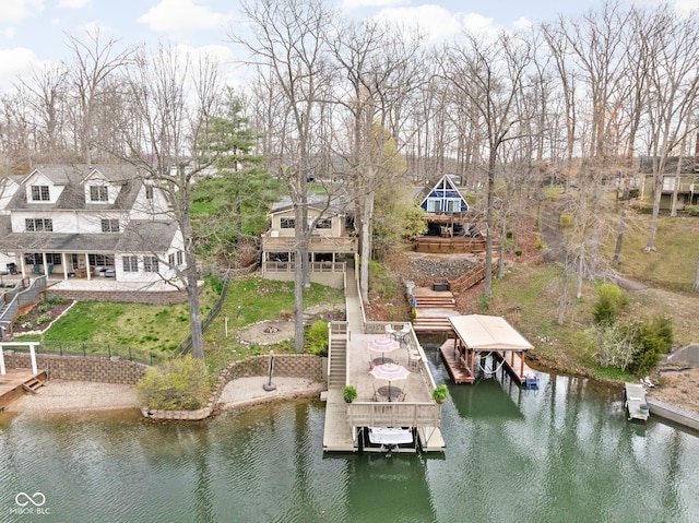6948 Eagle Dr, Nineveh, IN 46164 - dock area with a fenced backyard, stairway, boat lift, a patio area, and a deck with water view