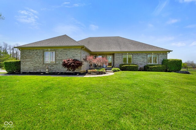 8890 N Pennington Rd, Mooresville, IN 46158 - single story home with brick siding, a shingled roof, and a front lawn
