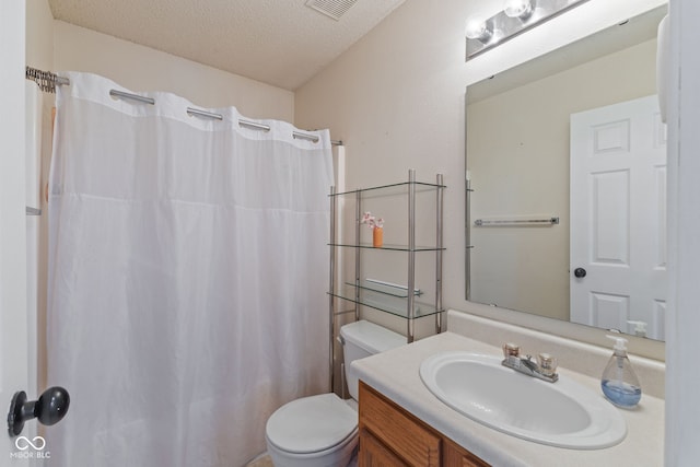 full bathroom with a shower with curtain, a textured ceiling, visible vents, vanity, and toilet