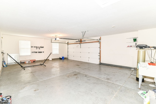 6479 Enclave Blvd, Greenwood, IN 46143 - garage featuring a garage door opener and baseboards