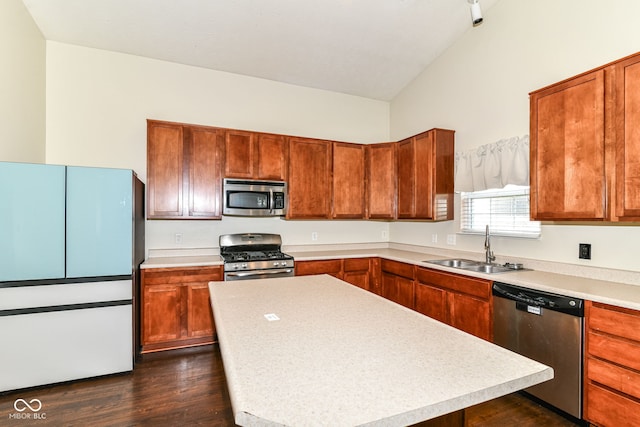 6479 Enclave Blvd, Greenwood, IN 46143 - kitchen with appliances with stainless steel finishes, a sink, light countertops, dark wood-style floors, and brown cabinets