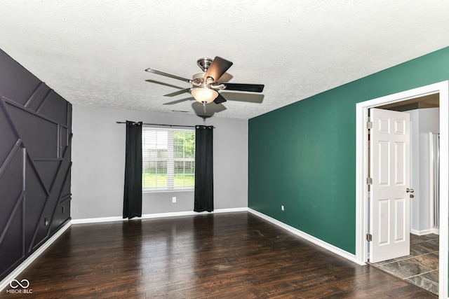 6479 Enclave Blvd, Greenwood, IN 46143 - spare room featuring ceiling fan, wood finished floors, a textured ceiling, and baseboards