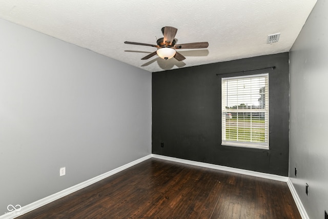 6479 Enclave Blvd, Greenwood, IN 46143 - spare room featuring wood finished floors, baseboards, ceiling fan, and a textured ceiling