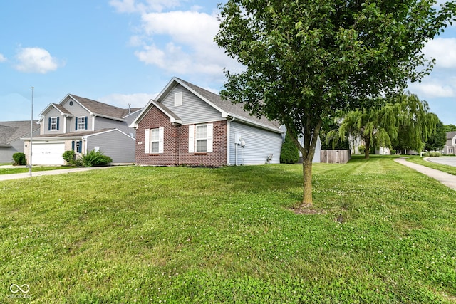 6479 Enclave Blvd, Greenwood, IN 46143 - view of front facade featuring brick siding and a front lawn