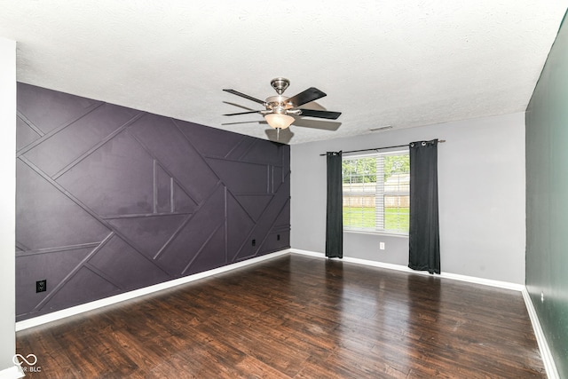 6479 Enclave Blvd, Greenwood, IN 46143 - spare room featuring wood finished floors, a ceiling fan, baseboards, and a textured ceiling