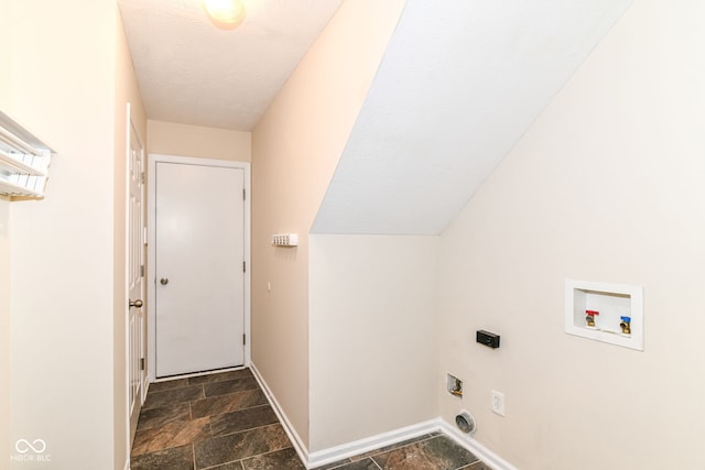 6479 Enclave Blvd, Greenwood, IN 46143 - washroom featuring washer hookup, stone tile flooring, electric dryer hookup, and baseboards