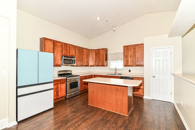 6479 Enclave Blvd, Greenwood, IN 46143 - kitchen with stainless steel appliances, a sink, light countertops, dark wood finished floors, and high vaulted ceiling