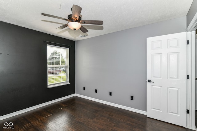 6479 Enclave Blvd, Greenwood, IN 46143 - spare room with wood finished floors, a ceiling fan, baseboards, and a textured ceiling