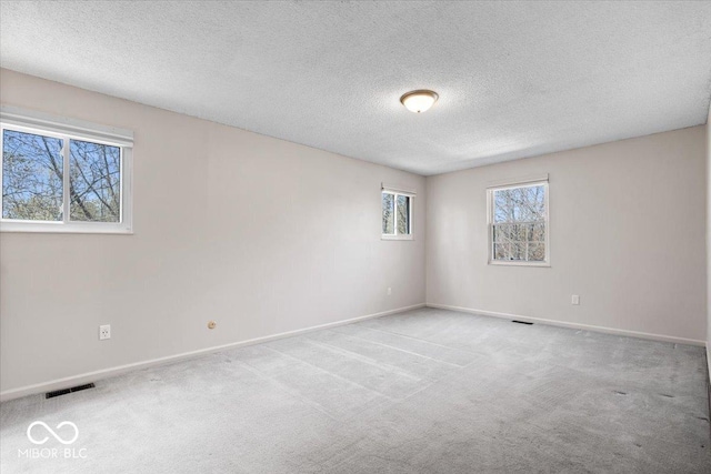 315 Heritage Ct, Fishers, IN 46038 - carpeted empty room with a textured ceiling, visible vents, and baseboards