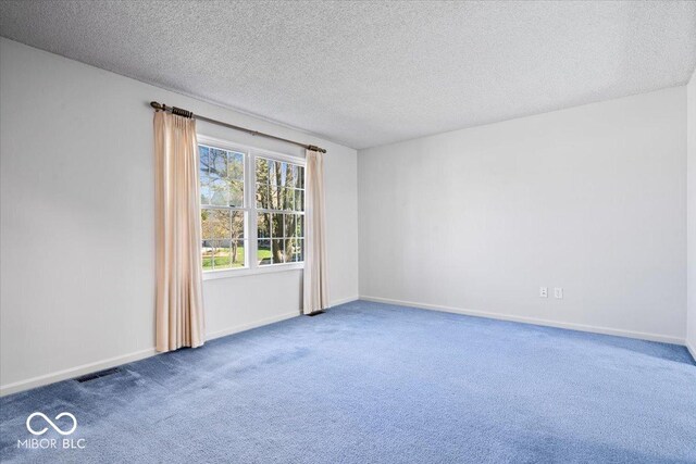 315 Heritage Ct, Fishers, IN 46038 - carpeted spare room featuring baseboards, a textured ceiling, and visible vents