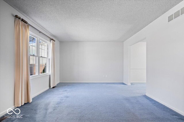315 Heritage Ct, Fishers, IN 46038 - spare room with a textured ceiling, visible vents, and carpet flooring
