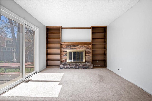 315 Heritage Ct, Fishers, IN 46038 - unfurnished living room with a textured ceiling, a healthy amount of sunlight, and carpet flooring