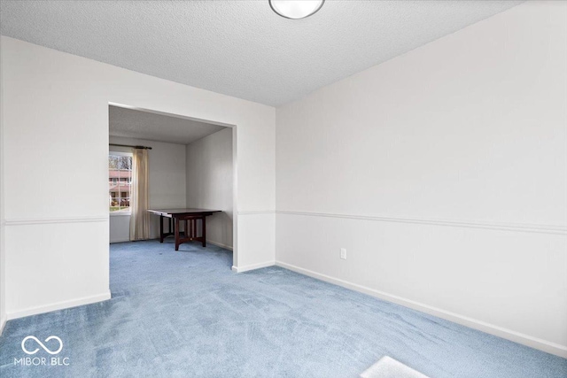 315 Heritage Ct, Fishers, IN 46038 - unfurnished room featuring carpet floors, a textured ceiling, and baseboards