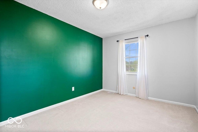 315 Heritage Ct, Fishers, IN 46038 - empty room featuring visible vents, carpet floors, baseboards, and a textured ceiling