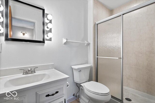 315 Heritage Ct, Fishers, IN 46038 - full bathroom featuring a shower stall, toilet, and vanity